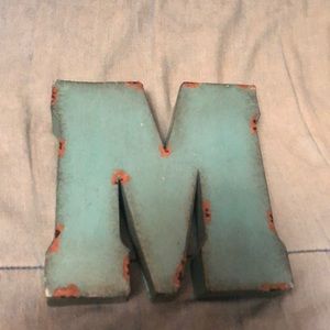 Metallic ‘M’ hanging decoration